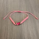 Βραχιόλι μακραμέ ροζ πεταλούδα με ροζ κορδόνι