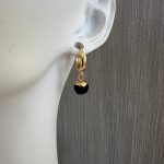 Χρυσοί κρίκοι με μαύρες πέτρες