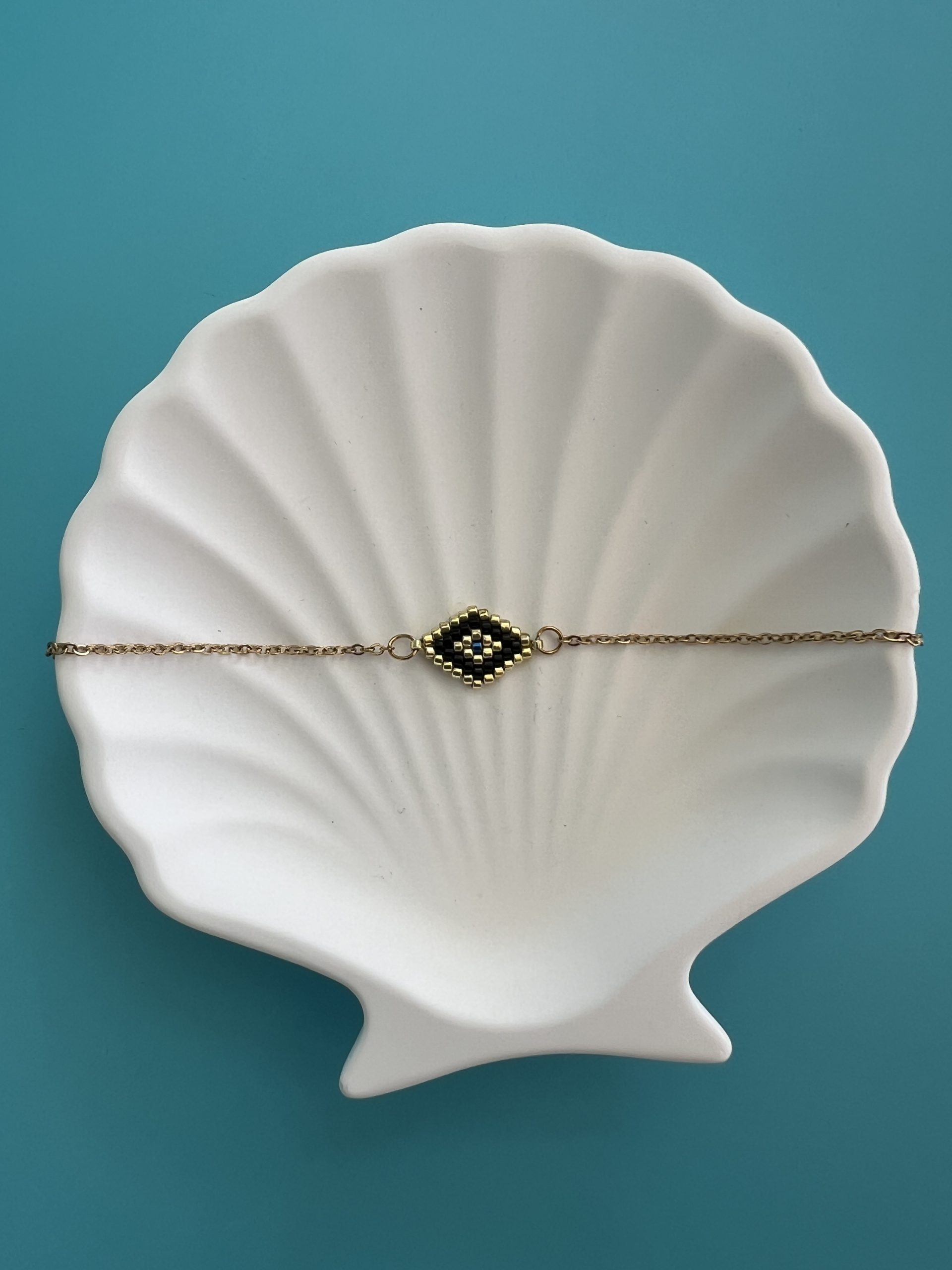 BRA169 Βραχιόλι μάτι κεντημένο με μαύρες χάντρες Miyuki και χρυσή αλυσίδα - Image 1