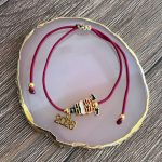 Βραχιόλι γούρι 2026 Άγιος Βασίλης με μπορντώ κορδόνι